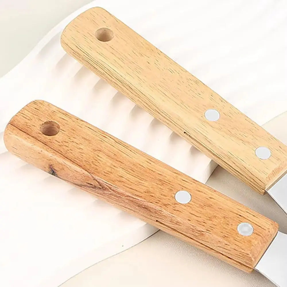 Manches en bois rivetés des spatules ajourées